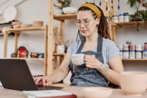 Female freelancer sitting at her desk in front of her laptop