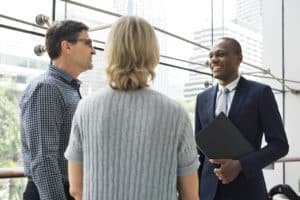 business employees discussing what business risk insurance covers with an insurance officer