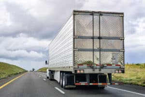 truck carrying cargo as it drives