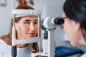 patient getting eye examination through group insurance plan