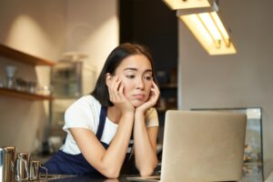 business owner looking at information about her underinsured business