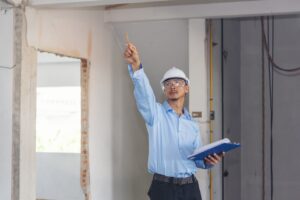 construction inspector evaluating completed work during a workmanship liability review