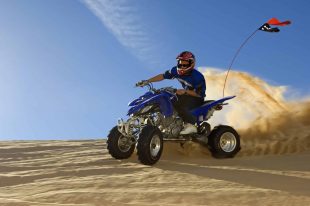 Man Riding Quad Bike In Desert ATV motor vehicle insurance
