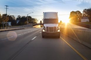 semi-truck-on-the-highway-at-sunrise_t20_domzV3 liability insurance for truckers is necessary when making cross-country trips